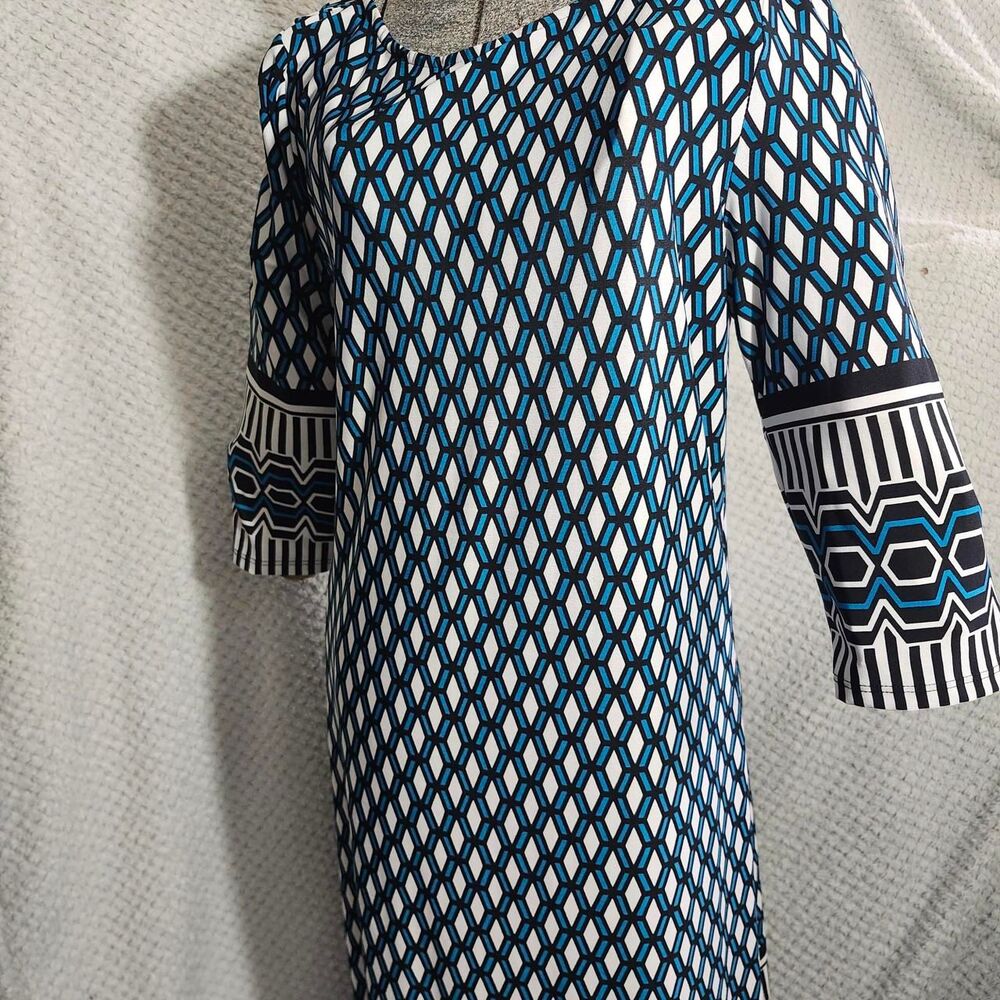 Ranna Gill dress features a geometric pattern in blue, black, and white